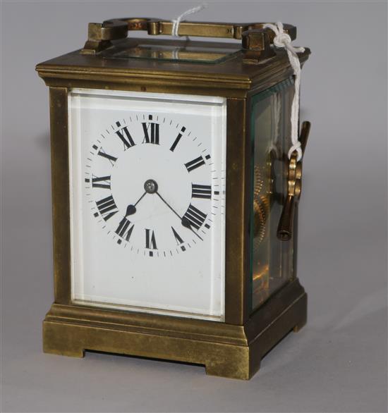 A gilt brass carriage clock, late 19th/early 20th century, with 8-day movement and white-enamelled dial,